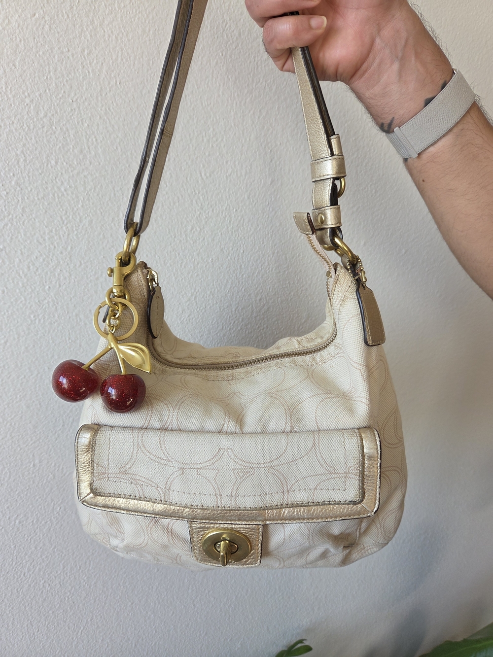 Coach Cream Signature Canvas Shoulder Bag with Gold Trim and Red Cherry Charm
